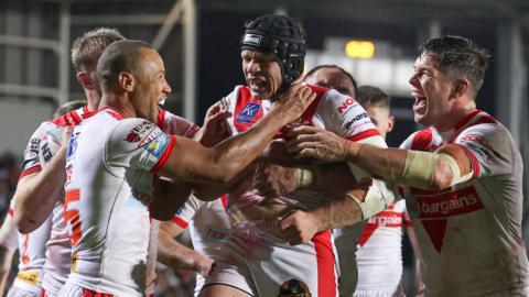 St Helens celebrate scoring a try