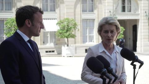 Ursula von der Leyen stands next to Emmanuel Macron