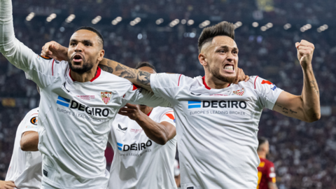 Sevilla players celebrate after scoring their first goal