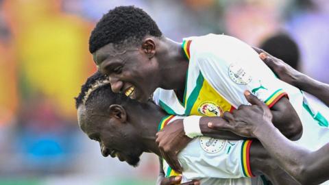 Senegal player Lamine Camara celebrates scoring his team's first goal during the Africa Cup of Nations (CAN) 2024 group C football match between Senegal and Gambia