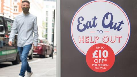 Man walks past restaurant