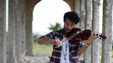 Mosul violinist Ameen Mukdad plays in the east of the city