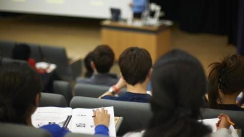 Students sitting in university lecture hall