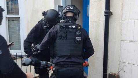 Police during the raids