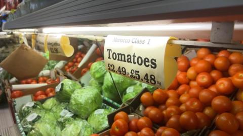 Boxes of tomatoes and lettuce