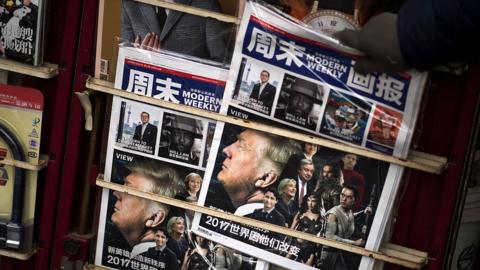 A Chinese magazine featuring US President-elect Donald Trump on the cover is seen at a newsstand in Shanghai on December 14, 2016