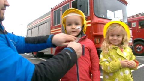 Children dressed as fire women