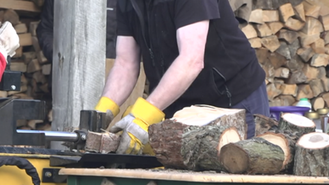 Man chopping logs