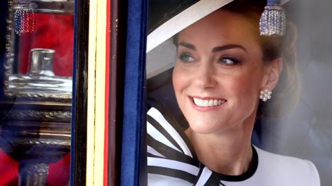 Catherine, Princess of Wales smiles as she travels by carriage during Trooping the Colour at Buckingham Palace on 15 June 2024 in London, England