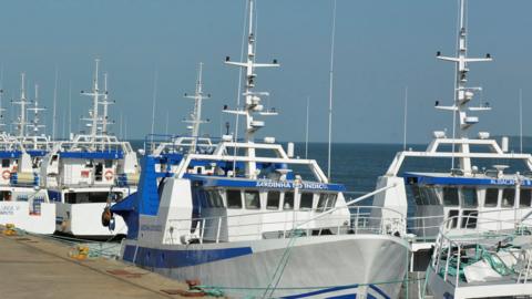 Security guards patrol past the EMATUM fishing fleet docked in Maputo, Mozambique, May 3, 2016.