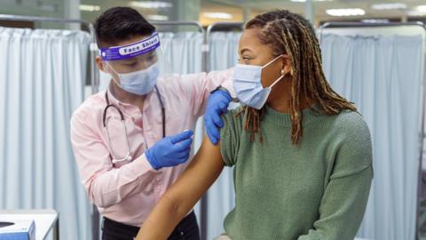 Doctor giving vaccine