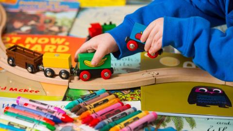 Child playing with toys