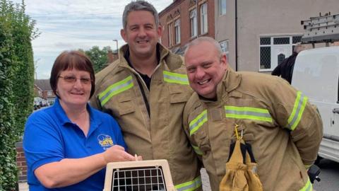 The firefighters with Cats Protection