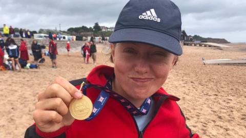 Natacha Searson posing with her gold medal