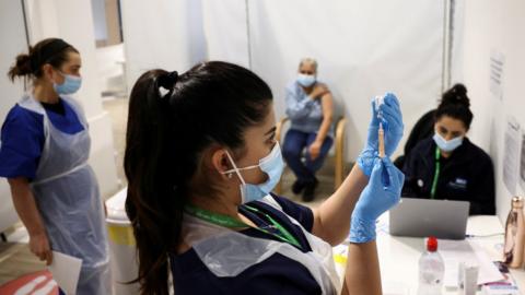 Nurse prepares Covid vaccination at centre in London