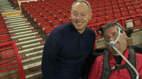 Nottingham Forest boss Steve Cooper with Reds fan Sam Perkins