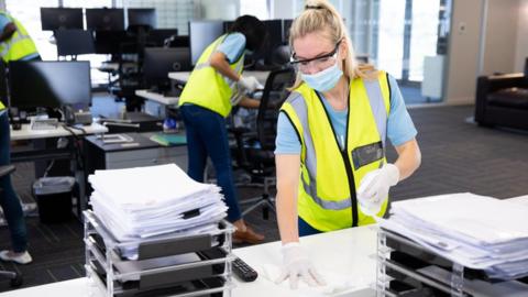 women cleaning office