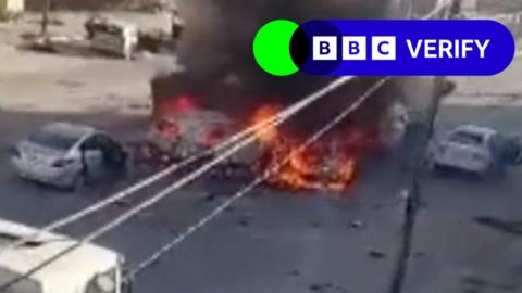 Cars on fire after a missile strike on convoy of civilians