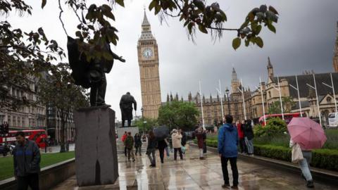 People walk near the Elizabeth Tower, more commonly known as Big Ben, on the day British Prime Minister Rishi Sunak called for a general election, in London, Britain, May 22, 2024.