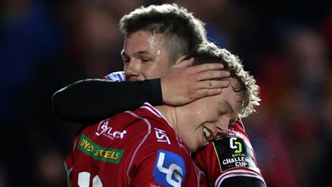 Scarlets players Sam Costelow and Steff Evans celebrate against Clermont