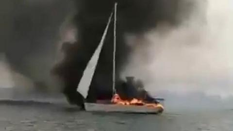 Burning yacht