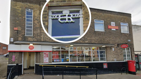 The Post Office branch on Chester-le-Street's Front Street. The building is in Art Deco-style made of brown brick and has a modern Post Office signage outside in red and white. The cypher, which is white, is on a window. It has a crown above it and reads 19 ER 36 with the Roman numerals VIII under it. It has also been put into a separate circle in the picture to show it more clearly.