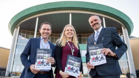 L-R Oliver Symons, Principal and CEO of Moulton College, Professor Anne-Marie Kilday, Vice Chancellor and CEO of University of Northampton and Jason Lancaster, Principal and CEO of Northampton College pose outside of Northampton College.
