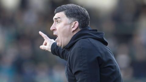 Southend United manager Kevin Maher shouts instructions to his players 