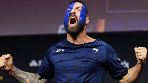 Paul Craig weighs in with the Scotland flag painted on his face