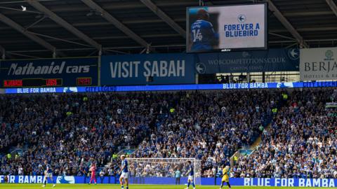 Cardiff City fans applaud in memory of Sol Bamba 