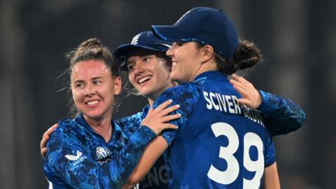 England's Nat Sciver-Brunt, Charlie Dean and Linsey Smith celebrate their win over India