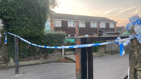 Police tape outside a house in Bright Ridge