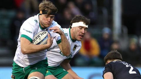 Northampton Saints second row Alex Coles carries the ball into a tackle against Saracens