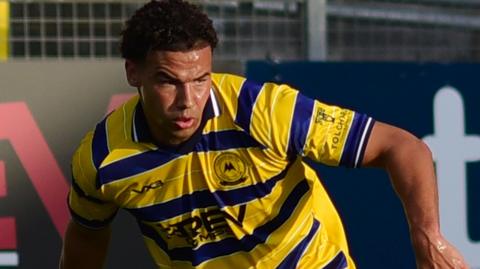 Austen Booth in pre-season action for Torquay United