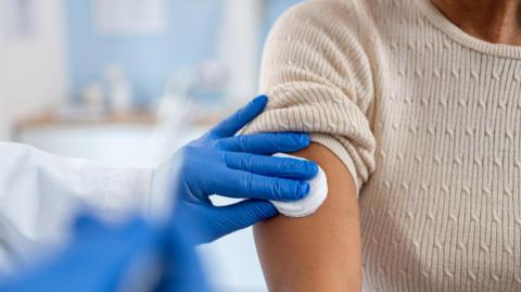Woman gets vaccine