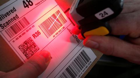 Stock photo of a parcel being scanned