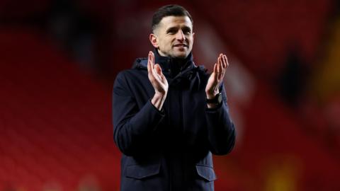 Portsmouth boss John Mousinho claps the travelling Pompey fans after the 3-1 win at Charlton