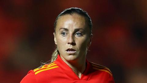 Wales player Natasha Harding, now known as Allen-Wyatt, is wearing a Wales football shirt