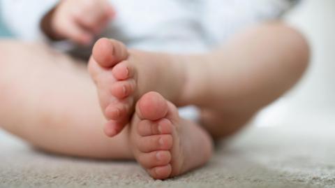 A close up picture of a baby's feet