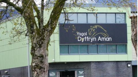 Sign above the entrance to Ysgol Dyffryn Aman