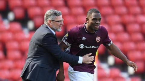 Craig Levein and Uche Ikpeazu