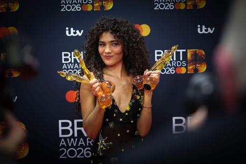 Olivia Dean holds four Brit Awards
