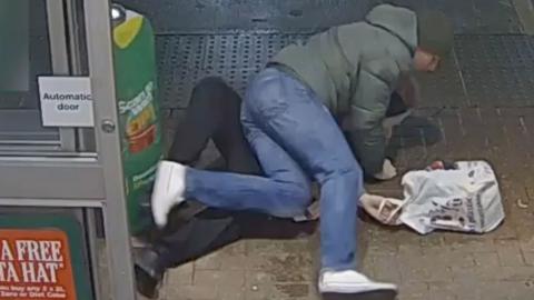 Shoplifter tackled by policeman.