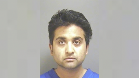 Police custody shot of Salil Korambayil