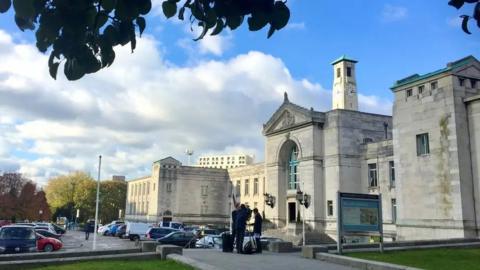 External view of Southampton Civic Centre - a large white art-deco building with the clock tower in the background