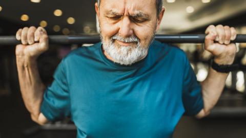 A man weightlifting in the gym