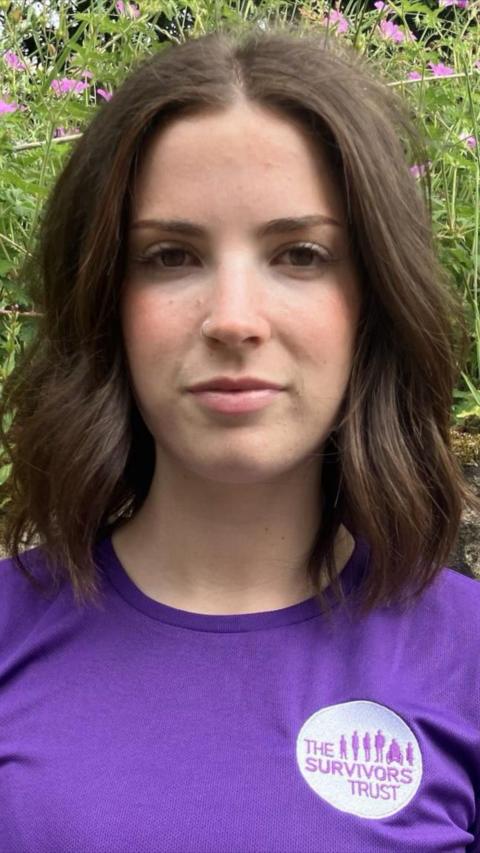Close up young woman with dark hair wearing mauve t-shirt