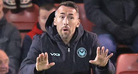 Christian Fuchs gestures with his hands in front of him