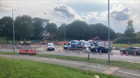 Cadent gas vans in a sectioned off area dealing with a gas leak