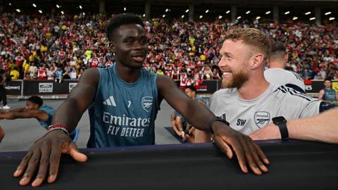 Sam Wilson pictured with Bukayo Saka 